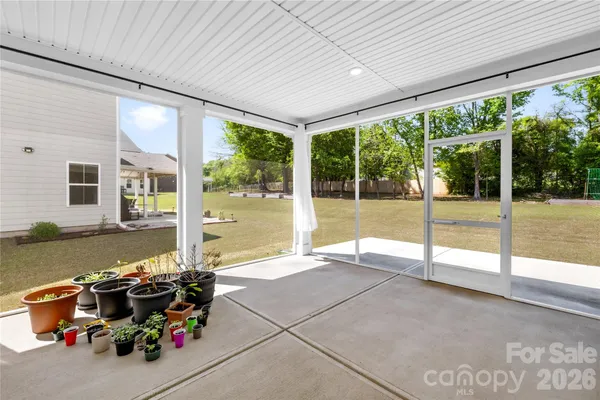 a very nice looking room with a large window and swimming pool