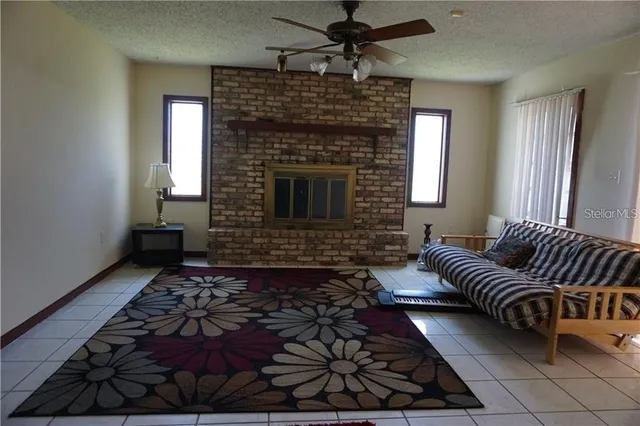 a living room with furniture rug and window