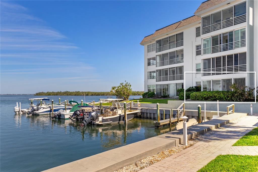 600 Sutton Place, Unit 104B Longboat Key, FL 34228 - Photo 35 of 53 a view of swimming pool with outdoor seating