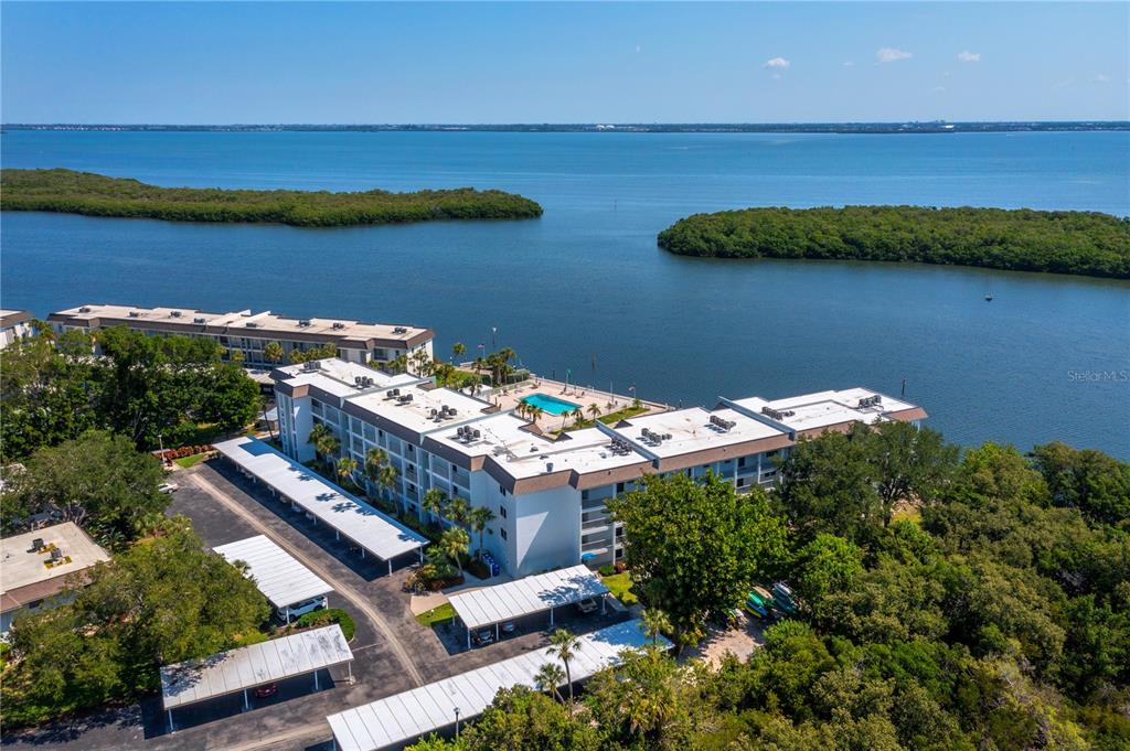 600 Sutton Place, Unit 104B Longboat Key, FL 34228 - Photo 36 of 53 an aerial view of a house with a lake view