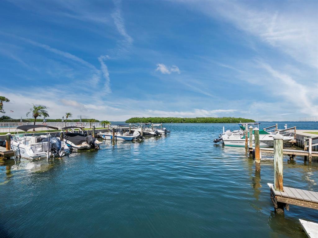 600 Sutton Place, Unit 104B Longboat Key, FL 34228 - Photo 42 of 53 a view of yard with ocean