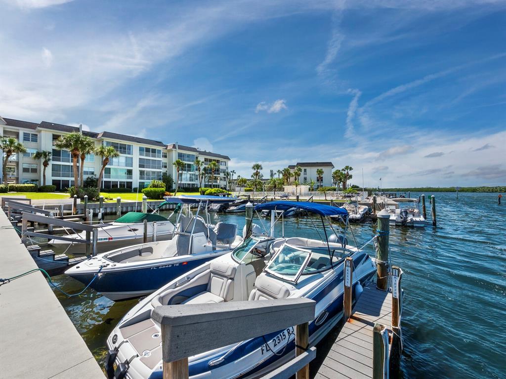 600 Sutton Place, Unit 104B Longboat Key, FL 34228 - Photo 8 of 53 a view of a patio with swimming pool