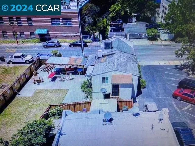 an aerial view of a house with outdoor space