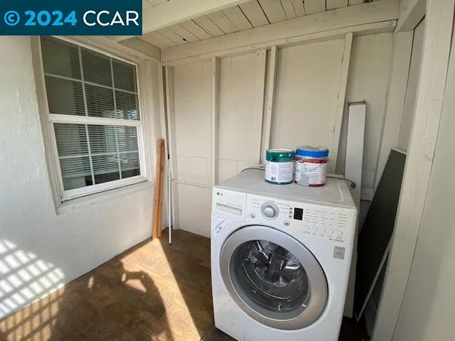a view of livingroom with washer and dryer