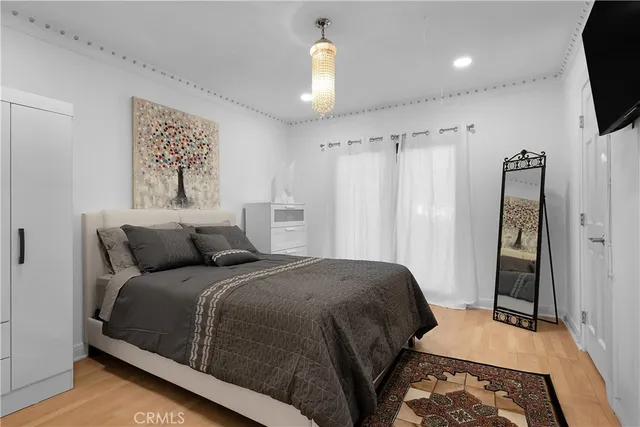 a roof deck with couches and a large tree