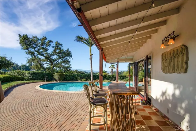a view of a swimming pool with a patio