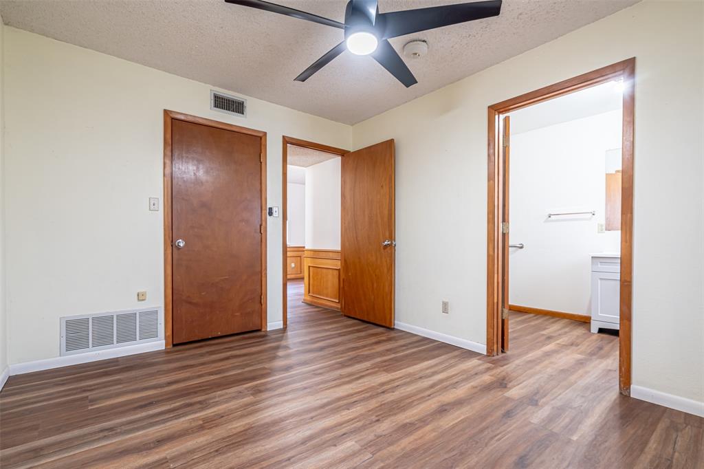 501 Endora Dublin, TX 76446 - Photo 31 of 39 an empty room with wooden floor and a ceiling fan