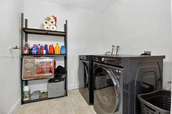 a bathroom with a shower and a sink