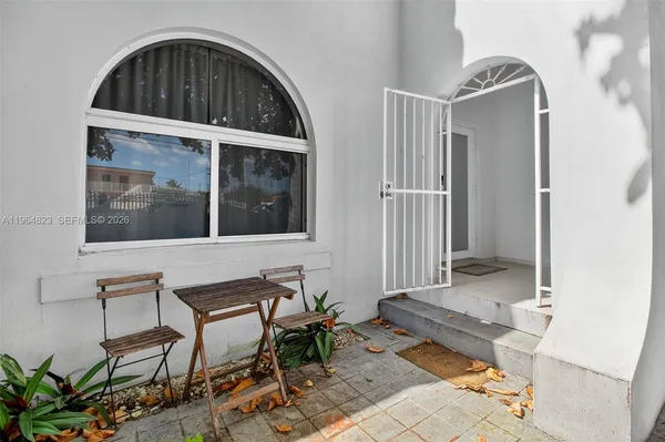 a view of a dining room with furniture and window
