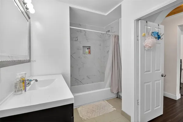 a bedroom with furniture and a bed