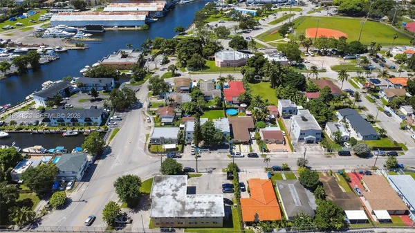 an aerial view of residential houses with outdoor space