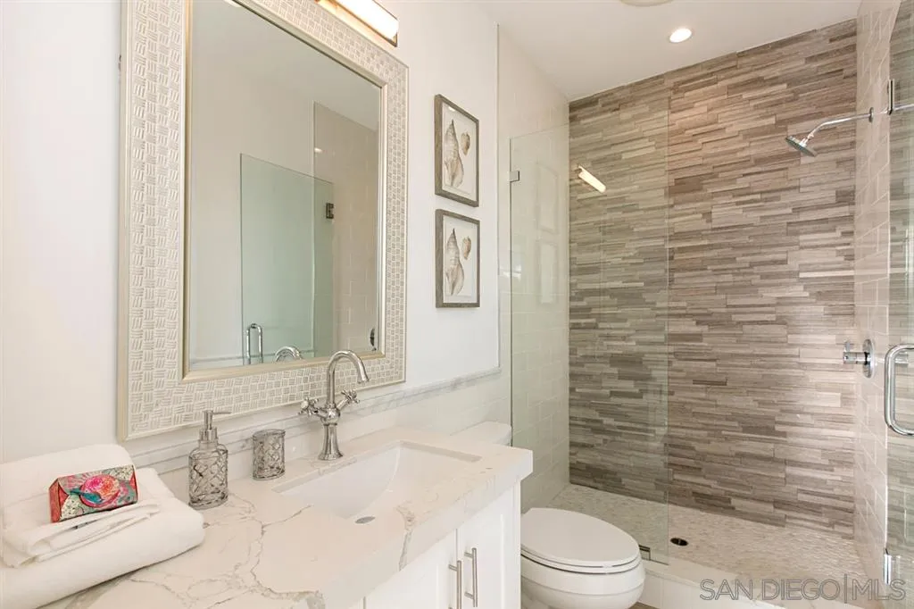 16582 Rio Vista Road San Diego, CA 92127 - Photo 11 of 20 a bathroom with a sink a toilet and shower