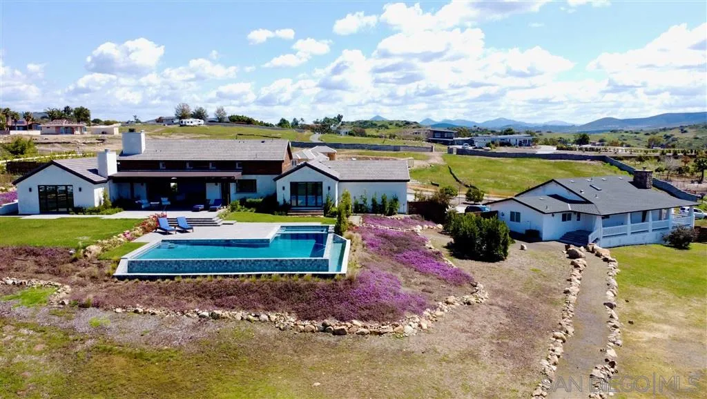 16582 Rio Vista Road San Diego, CA 92127 - Photo 2 of 20 a swimming pool view with a seating space