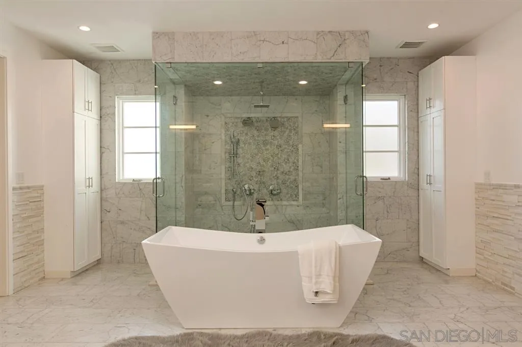 16582 Rio Vista Road San Diego, CA 92127 - Photo 9 of 20 a bathroom with a bathtub and shower
