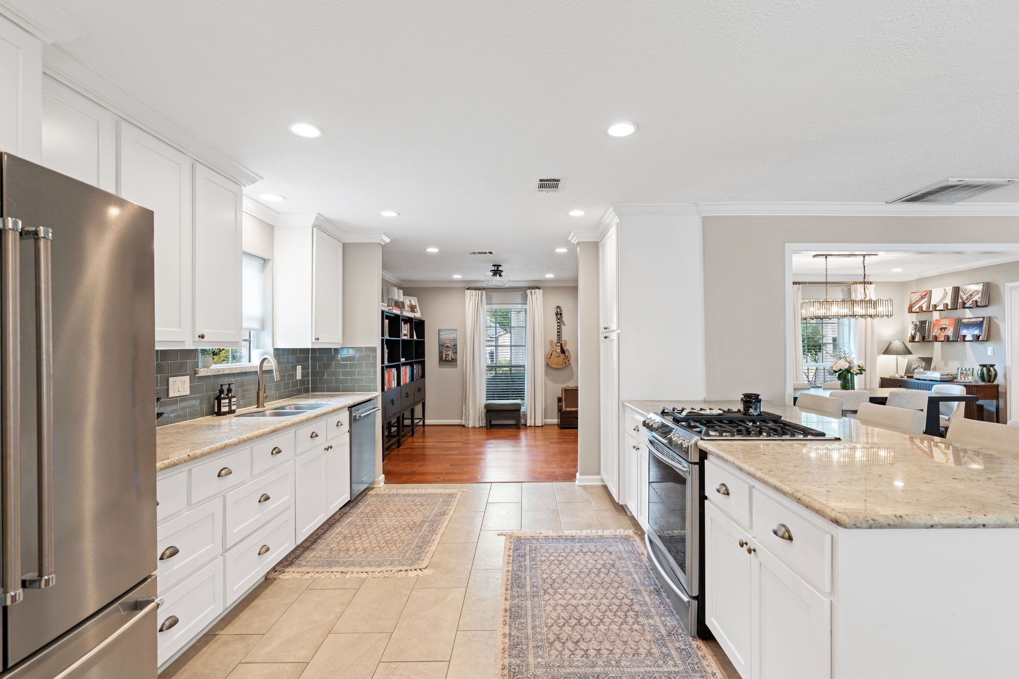 991 Curtin Street Houston, TX 77018 - Photo 11 of 39 Recessed lighting is carried from the kitchen through to the flex space/home office at the front of the home.