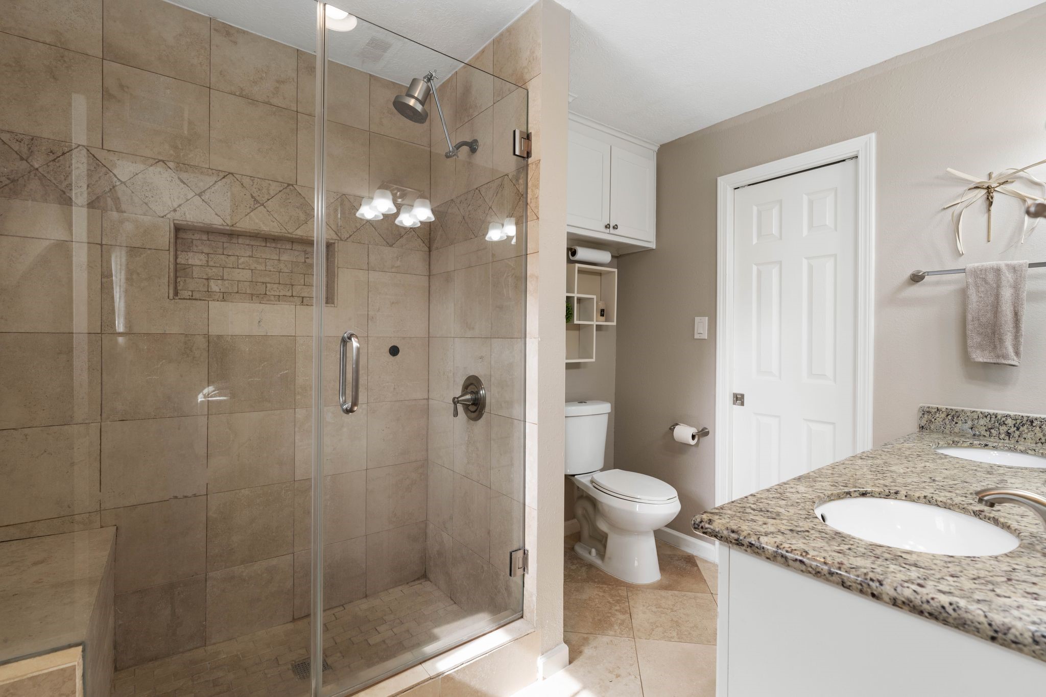 991 Curtin Street Houston, TX 77018 - Photo 21 of 39 a bathroom with a granite countertop sink a toilet and shower
