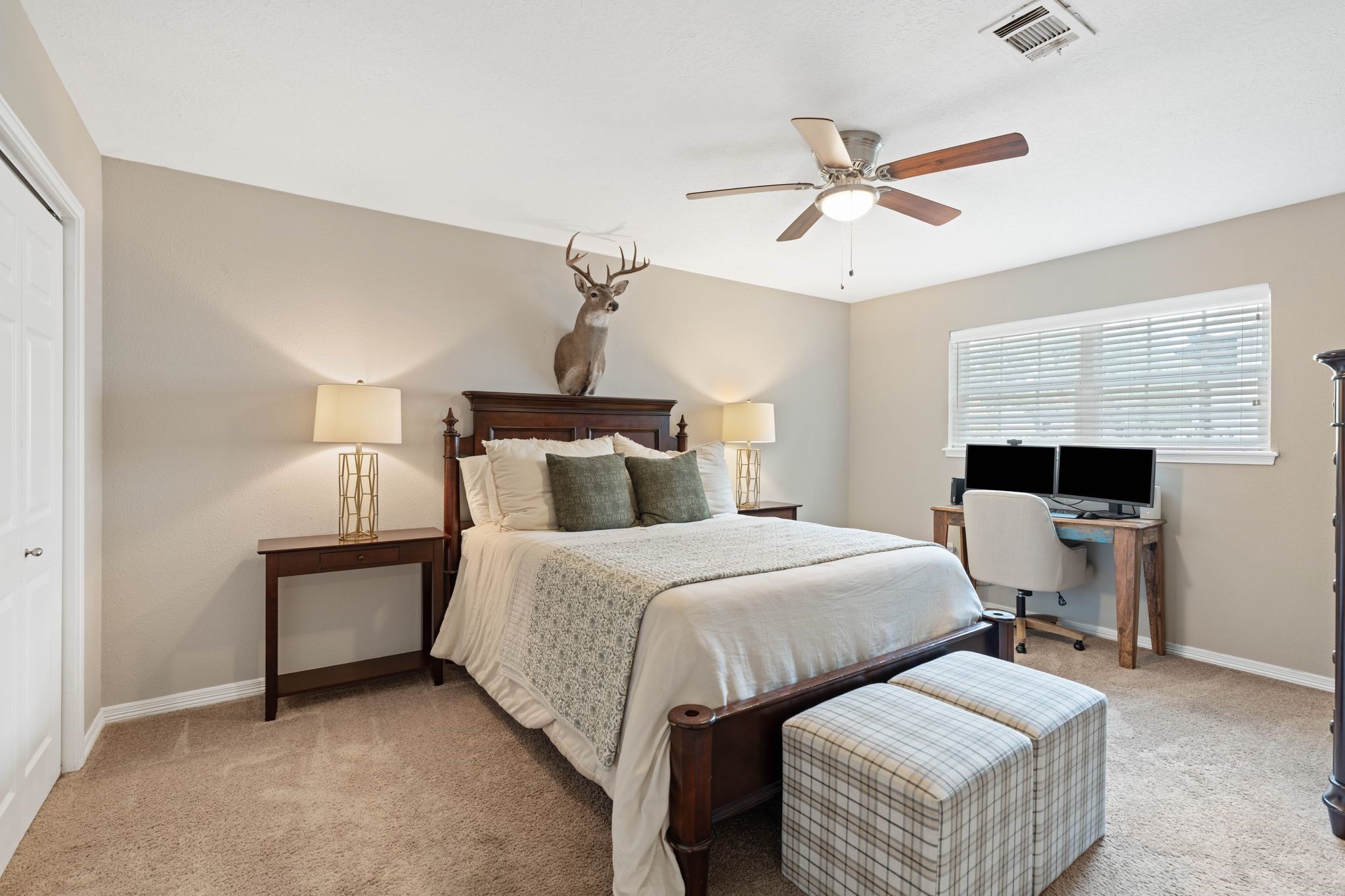 991 Curtin Street Houston, TX 77018 - Photo 23 of 39 The first of the two guest bedrooms is large enough to accommodate a king size bed, two night stands, a dresser and a desk with plenty of room to spare.