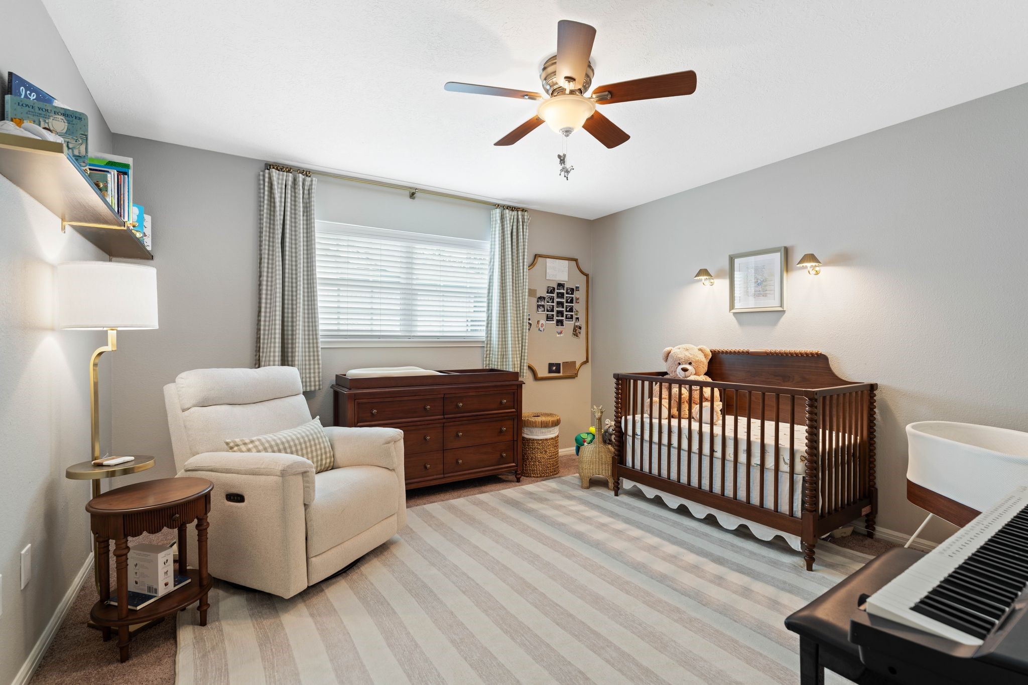 991 Curtin Street Houston, TX 77018 - Photo 24 of 39 The second guest bedroom features a large window with 2 inch blinds, sconce lighting, a ceiling fan with light kit, and warm color palette.