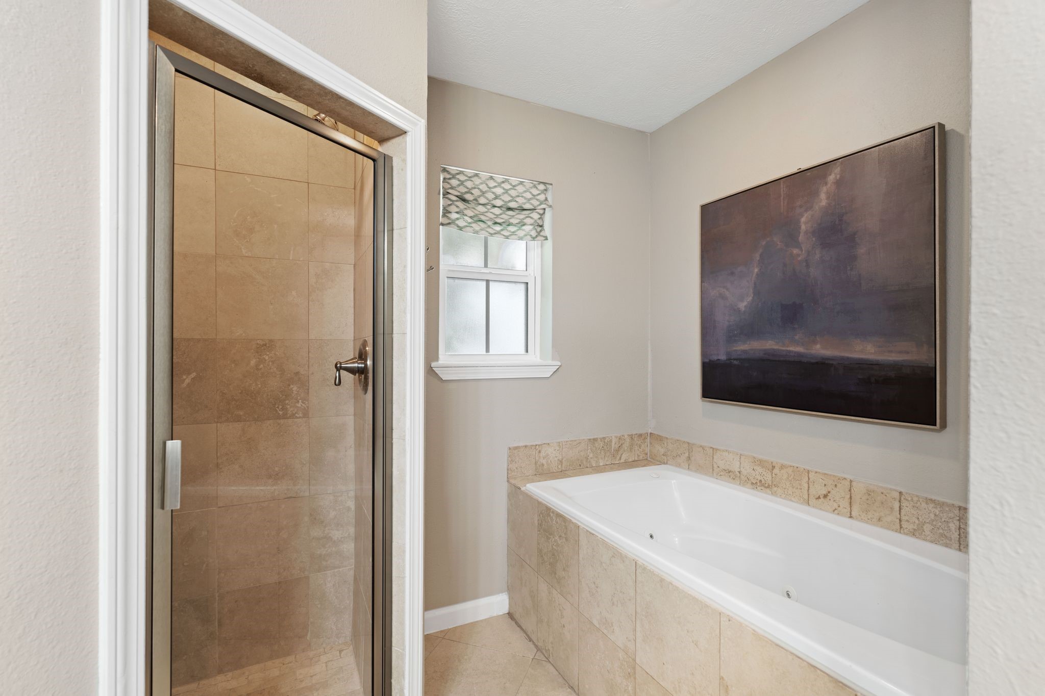 991 Curtin Street Houston, TX 77018 - Photo 26 of 39 a bathroom with a tub and a flat screen tv
