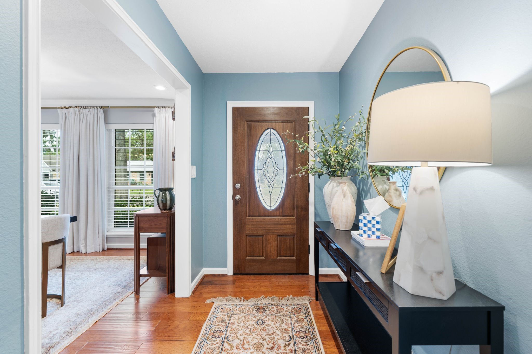 991 Curtin Street Houston, TX 77018 - Photo 3 of 39 Upon entry you are greeted by a wooden front door with leaded glass accent. Fresh blue paint color invites you into the home.
