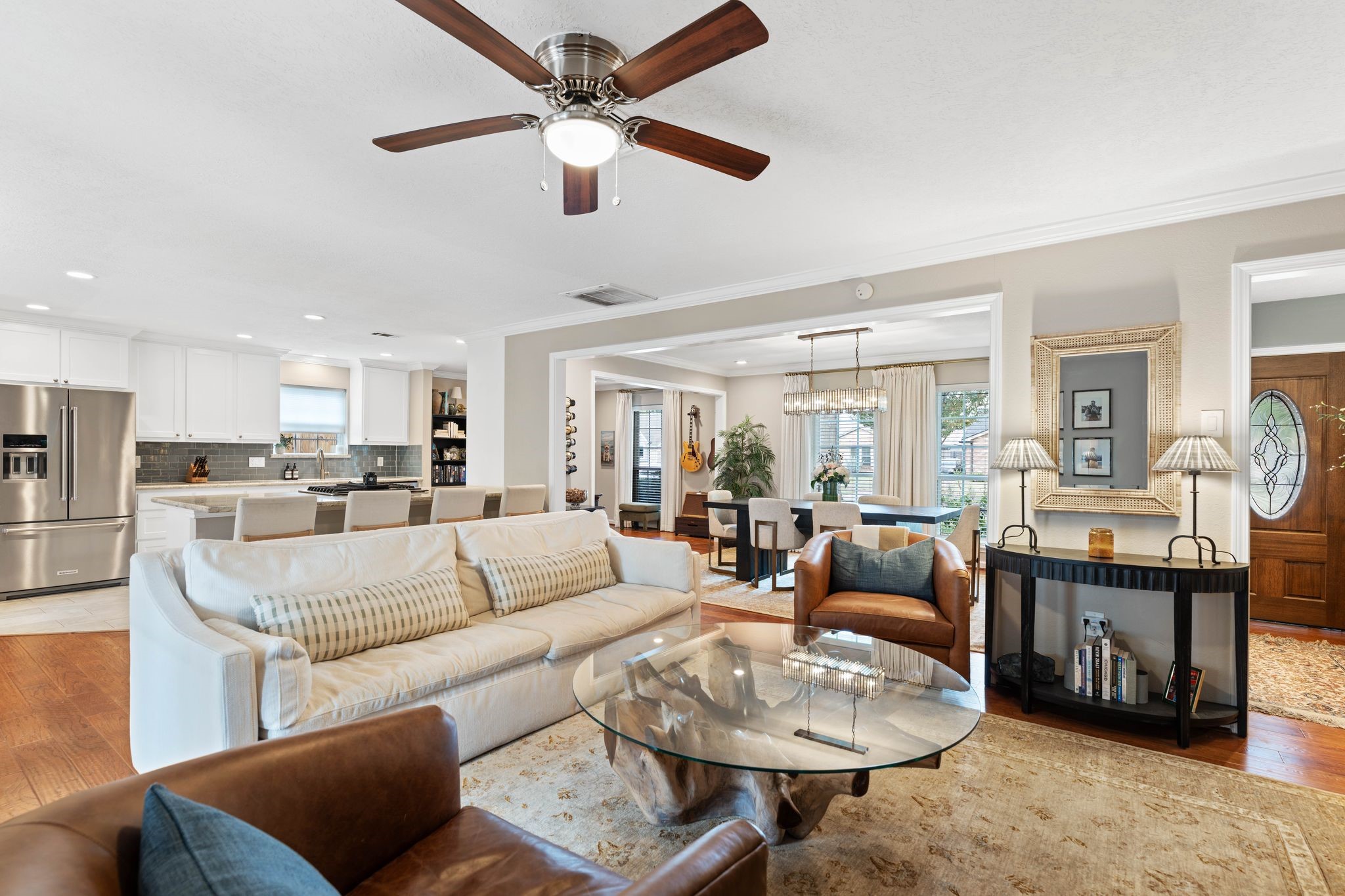 991 Curtin Street Houston, TX 77018 - Photo 6 of 39 The living room is the center of the home with sight lines to the formal dining space, kitchen and breakfast nook. Neutral colors and classic engineered hardwood floors provide a blank slate for any style.