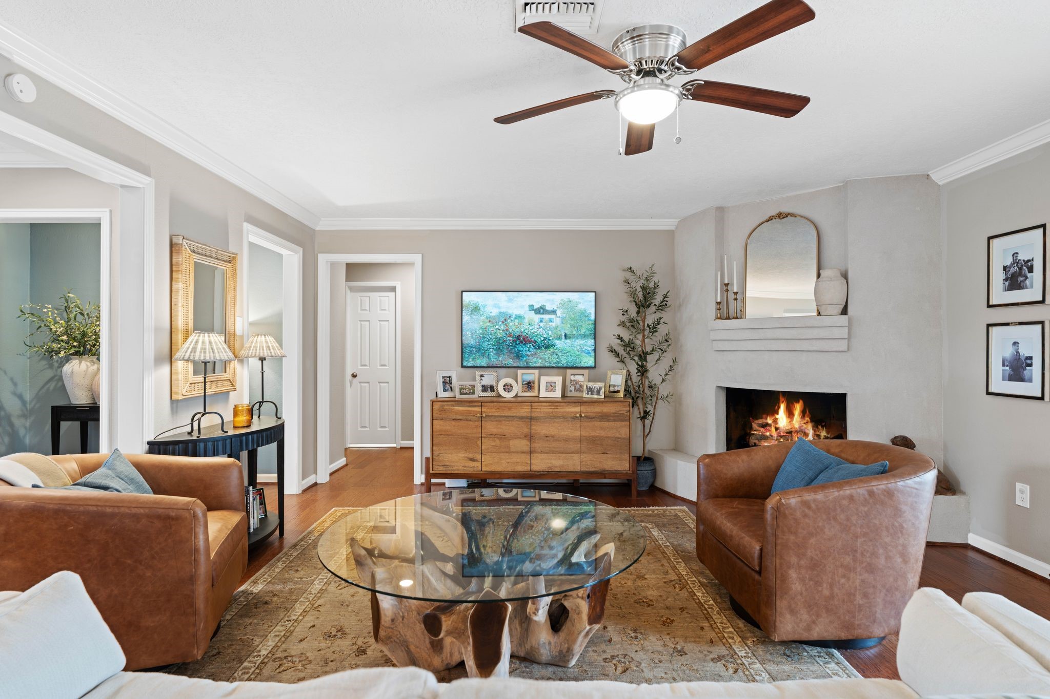 991 Curtin Street Houston, TX 77018 - Photo 7 of 39 A gorgeous plaster fireplace provides a unique element to a classic ranch style home. Gas connections make it easy to enjoy cozy nights by the fire.