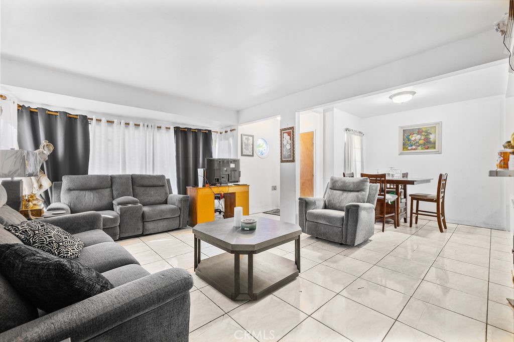 4237 Abbott Road Lynwood, CA 90262 - Photo 11 of 39 a living room with furniture and a couch