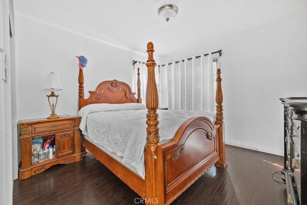4237 Abbott Road Lynwood, CA 90262 - Photo 12 of 39 a view of bedroom with furniture and wooden floor