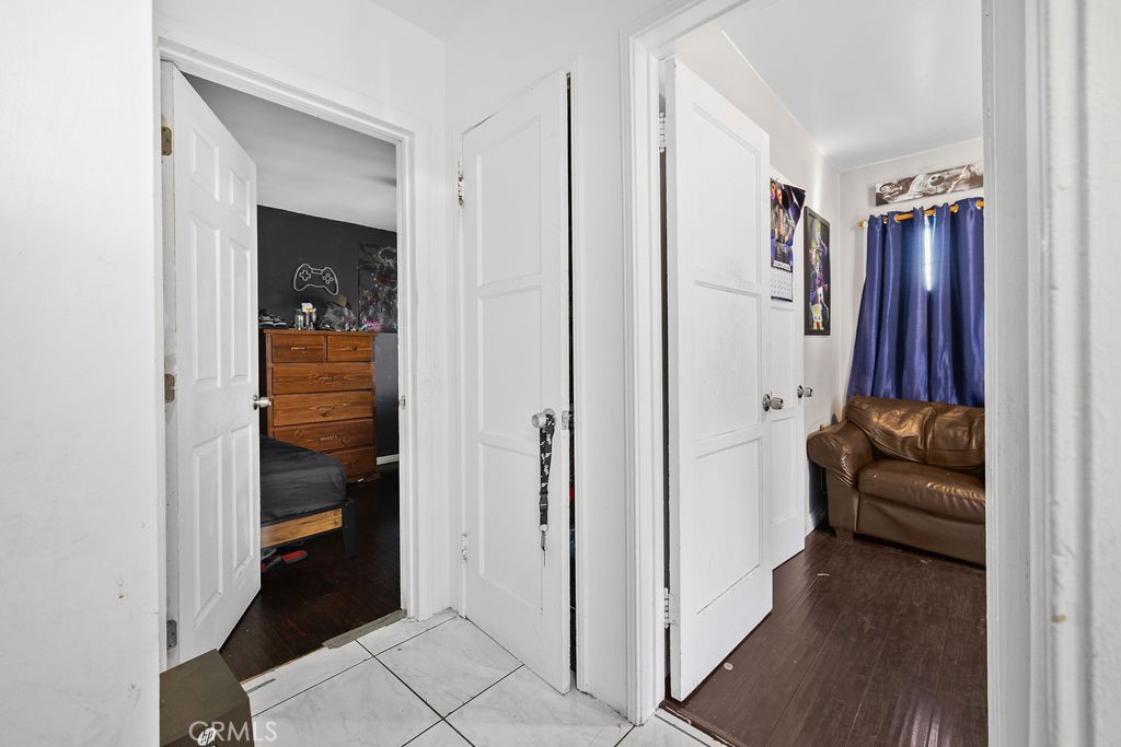 4237 Abbott Road Lynwood, CA 90262 - Photo 16 of 39 a living room with furniture and a closet