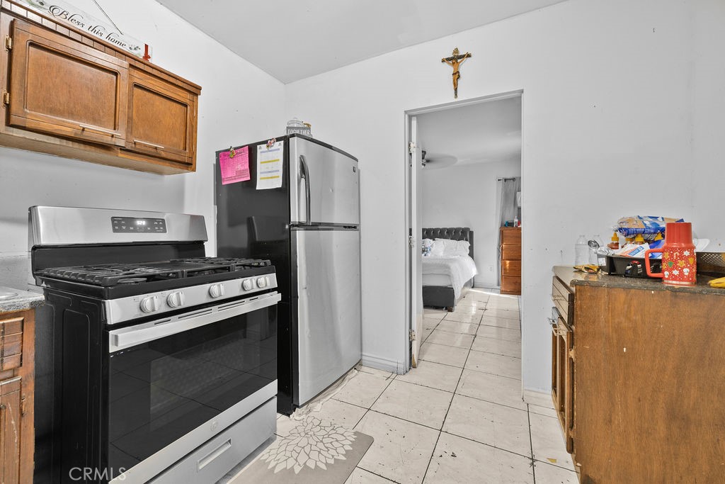 4237 Abbott Road Lynwood, CA 90262 - Photo 18 of 39 a kitchen with a stove and a refrigerator