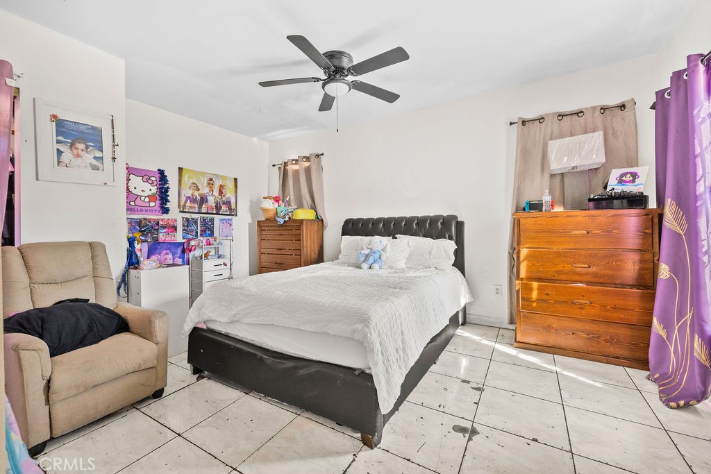 4237 Abbott Road Lynwood, CA 90262 - Photo 20 of 39 a bedroom with a bed and a couch