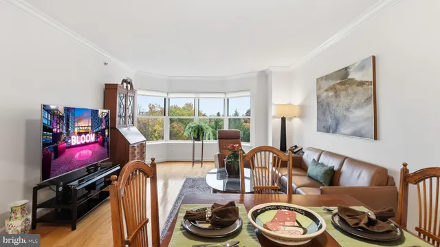 a dining room with furniture and a window