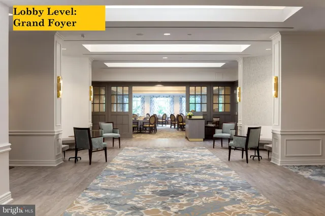 a living room with furniture a fireplace and a table