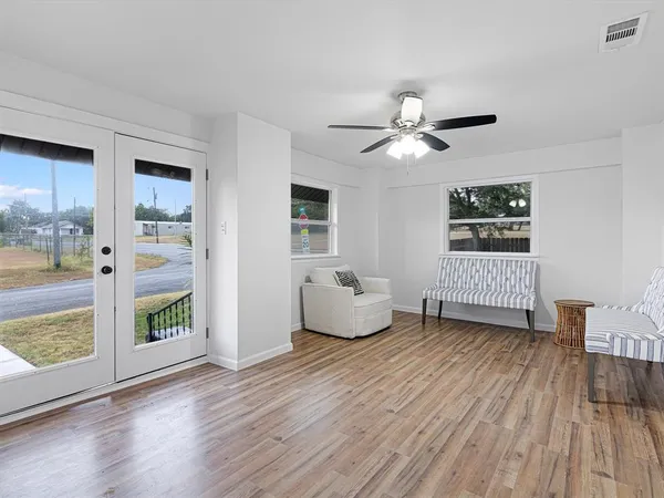 a living room with a table and a window