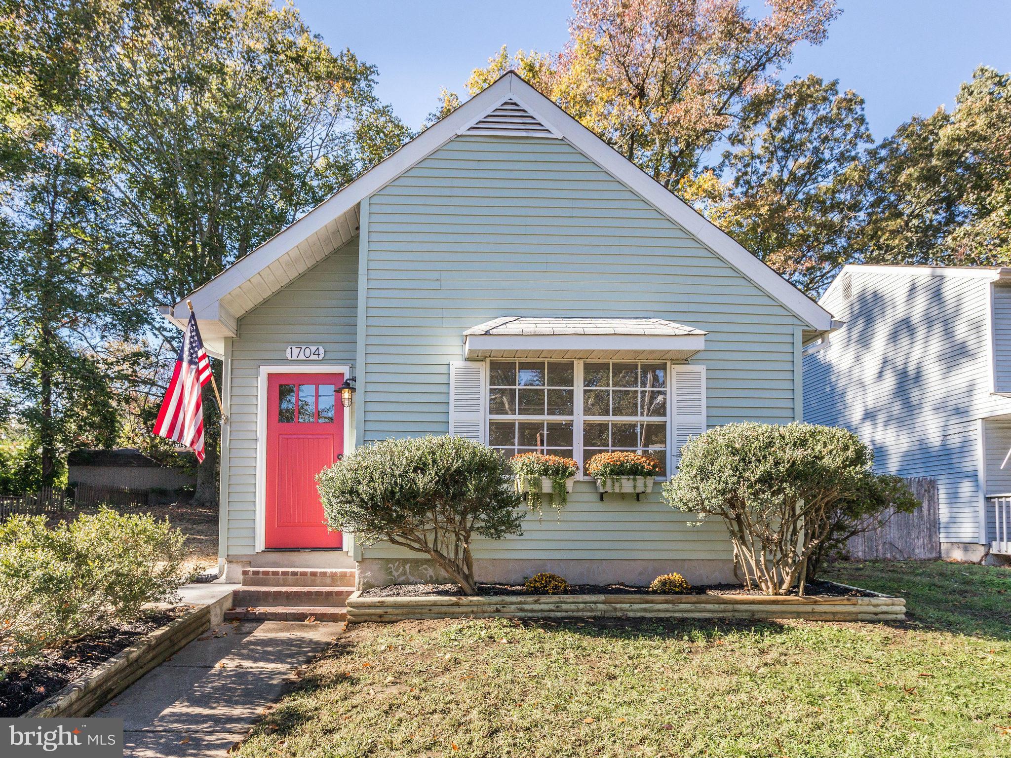 1704 Forestville Road Edgewater, MD 21037 - Photo 1 of 24 a front view of a house with a yard