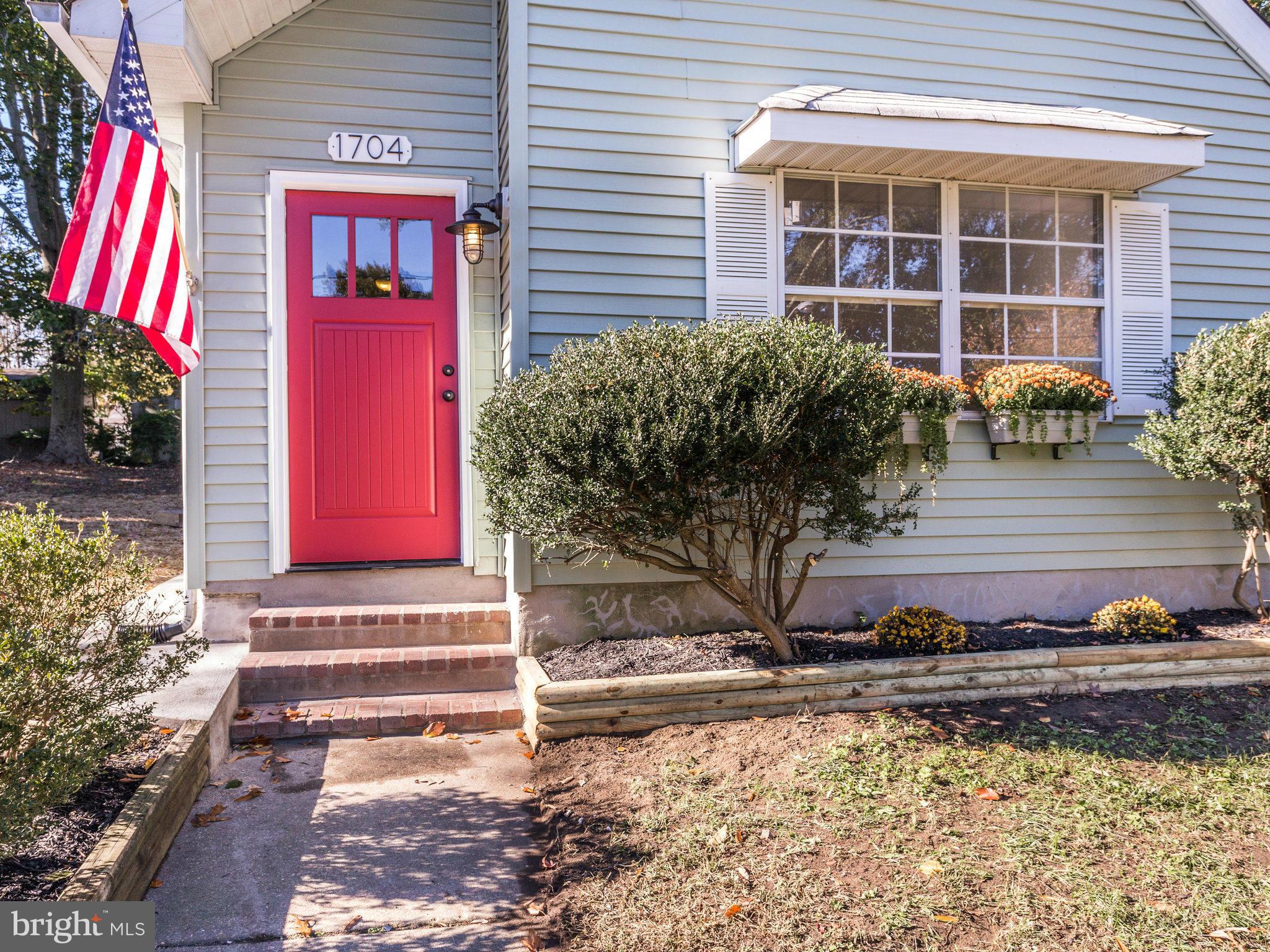 1704 Forestville Road Edgewater, MD 21037 - Photo 3 of 24 a front view of a house with a yard