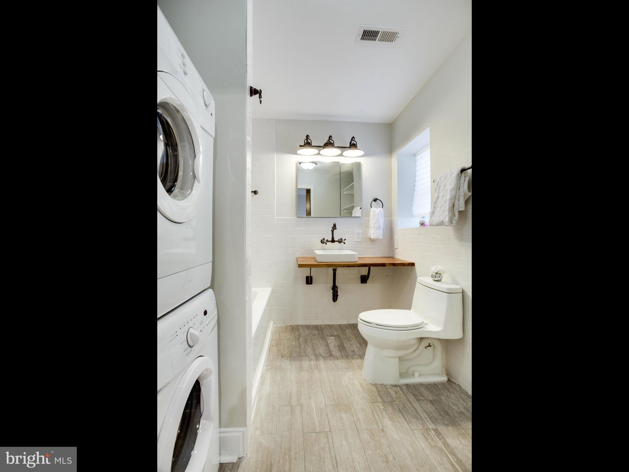 1704 Forestville Road Edgewater, MD 21037 - Photo 21 of 24 a bathroom with a toilet sink and mirror