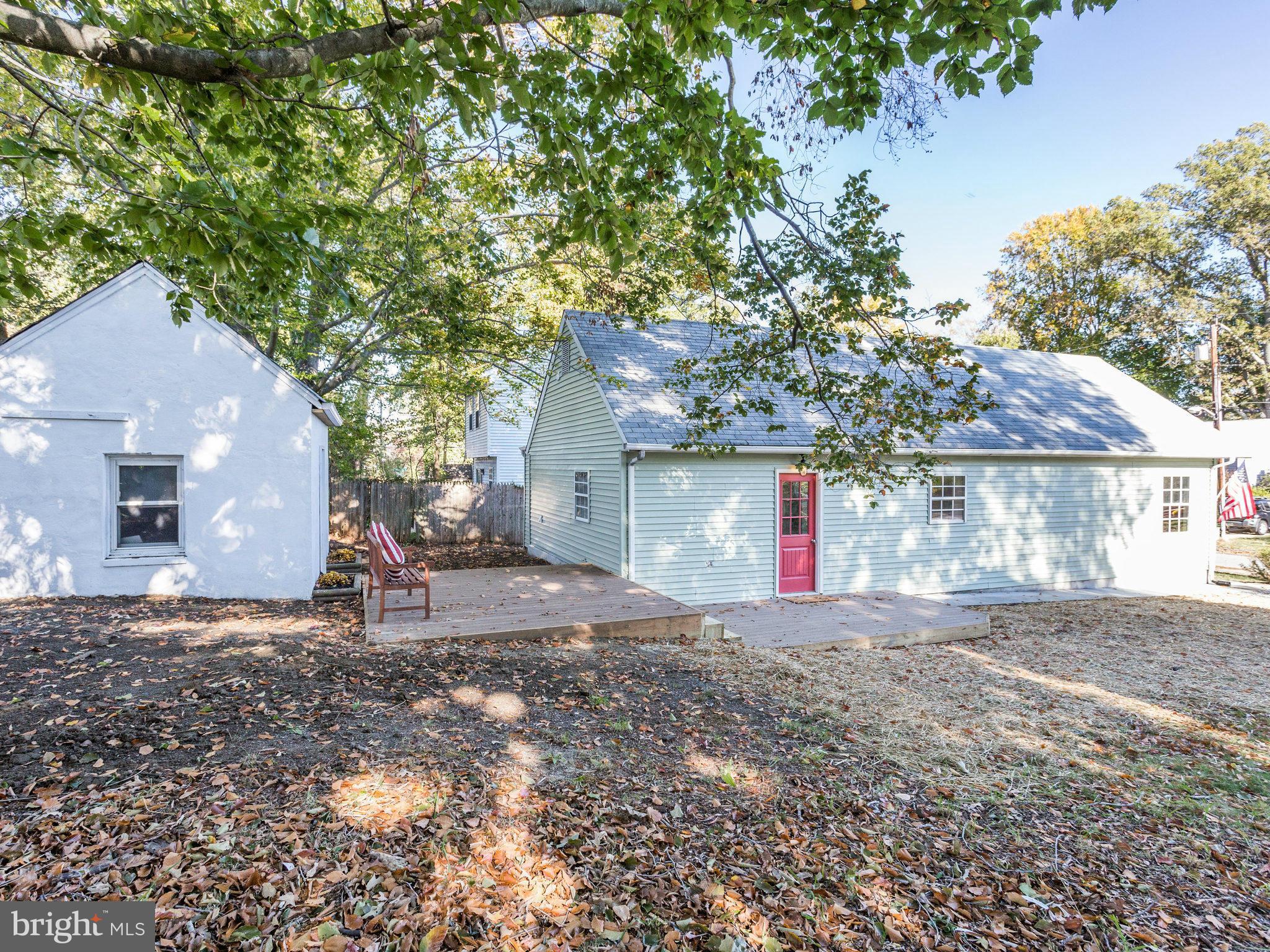 1704 Forestville Road Edgewater, MD 21037 - Photo 23 of 24 a view of a house with large tree and wooden fence
