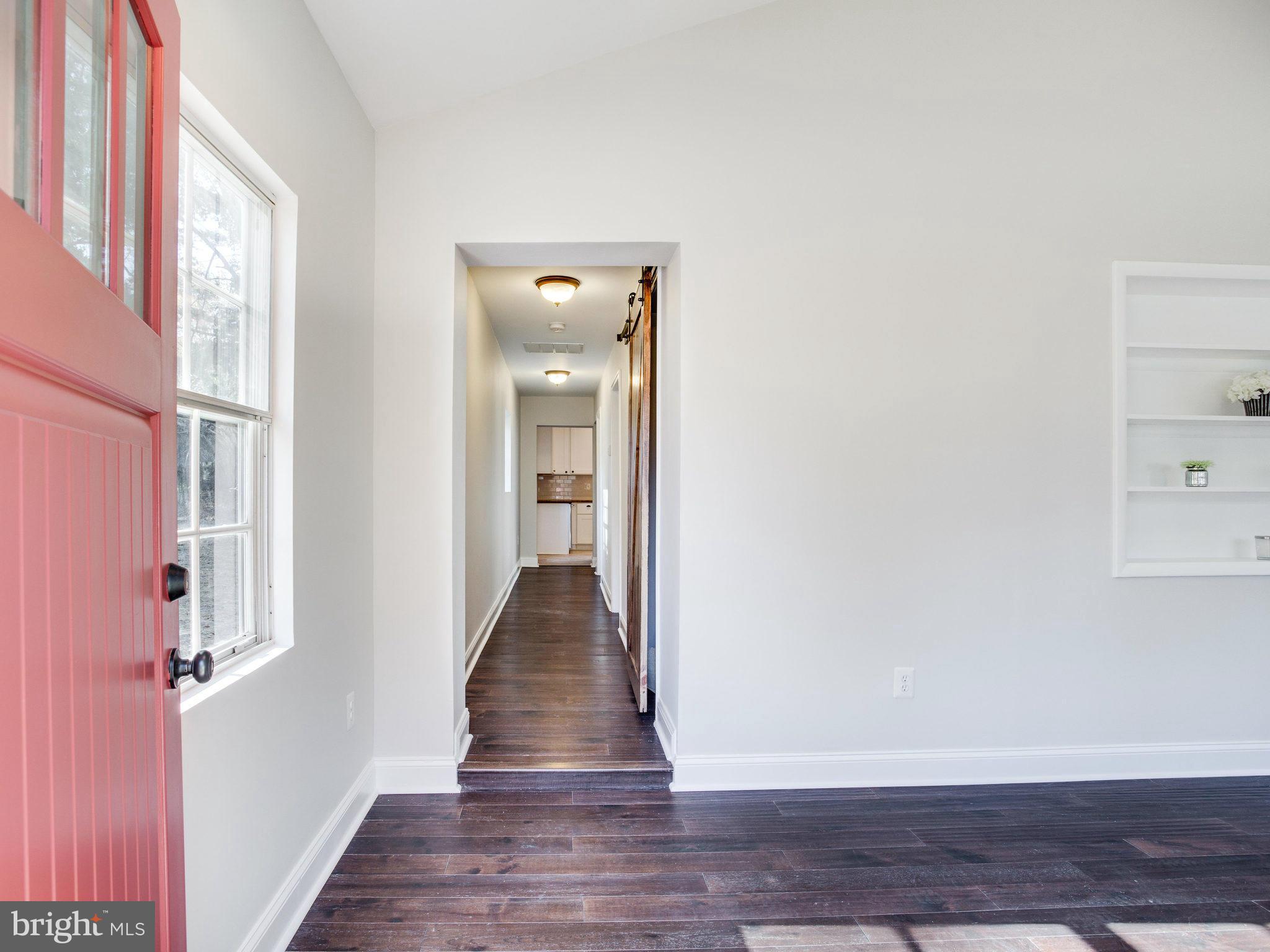 1704 Forestville Road Edgewater, MD 21037 - Photo 4 of 24 a view of a hallway with wooden floor