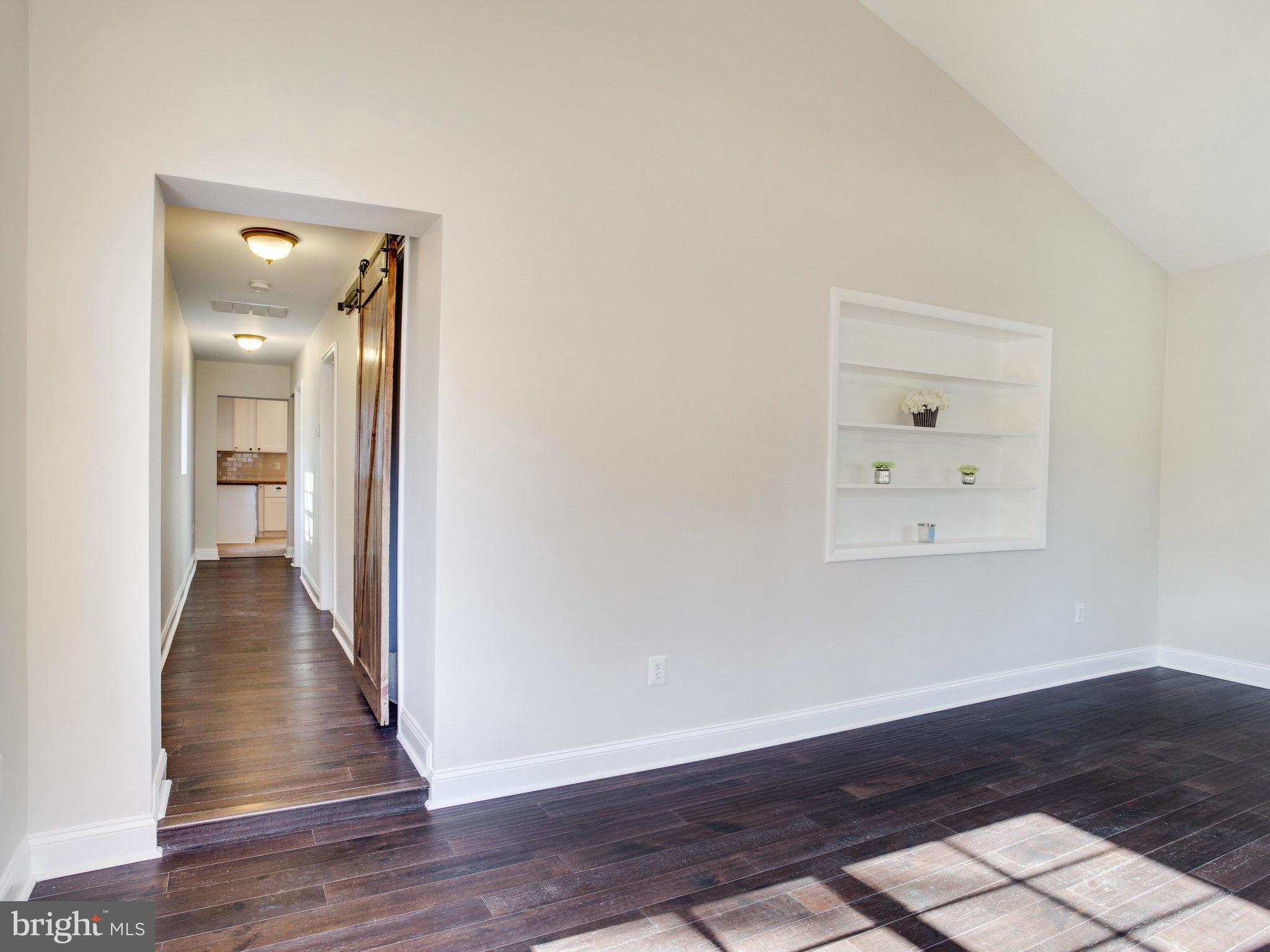 1704 Forestville Road Edgewater, MD 21037 - Photo 5 of 24 a view of a hallway with wooden floor
