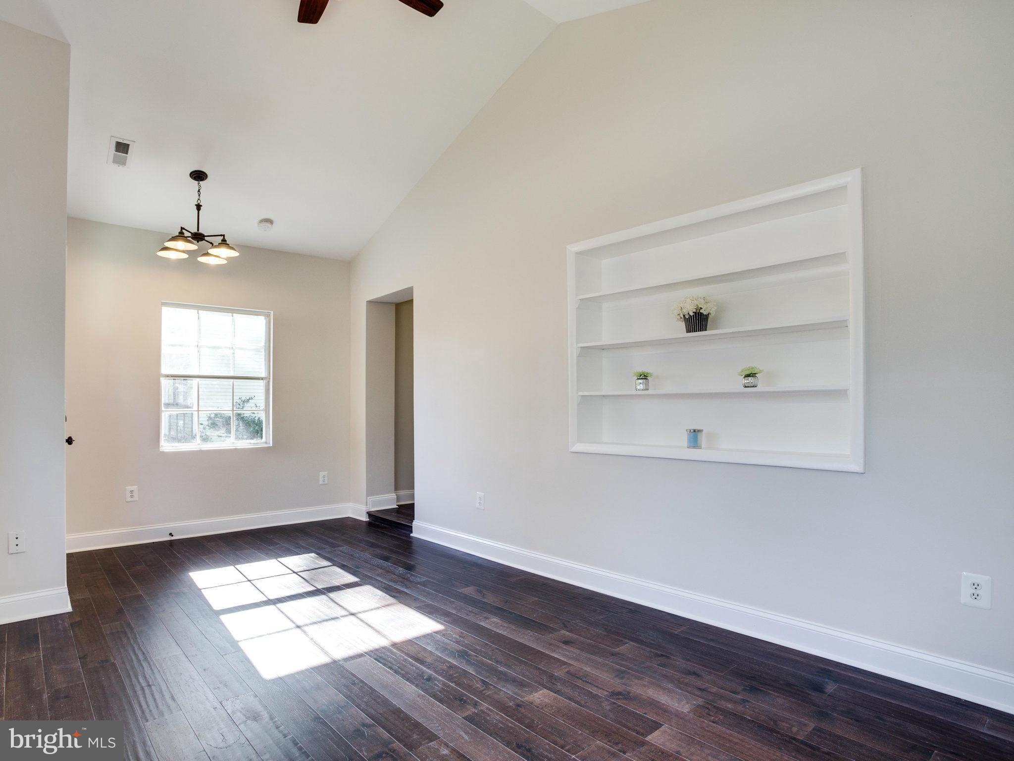 1704 Forestville Road Edgewater, MD 21037 - Photo 8 of 24 wooden floor in an empty room with a window