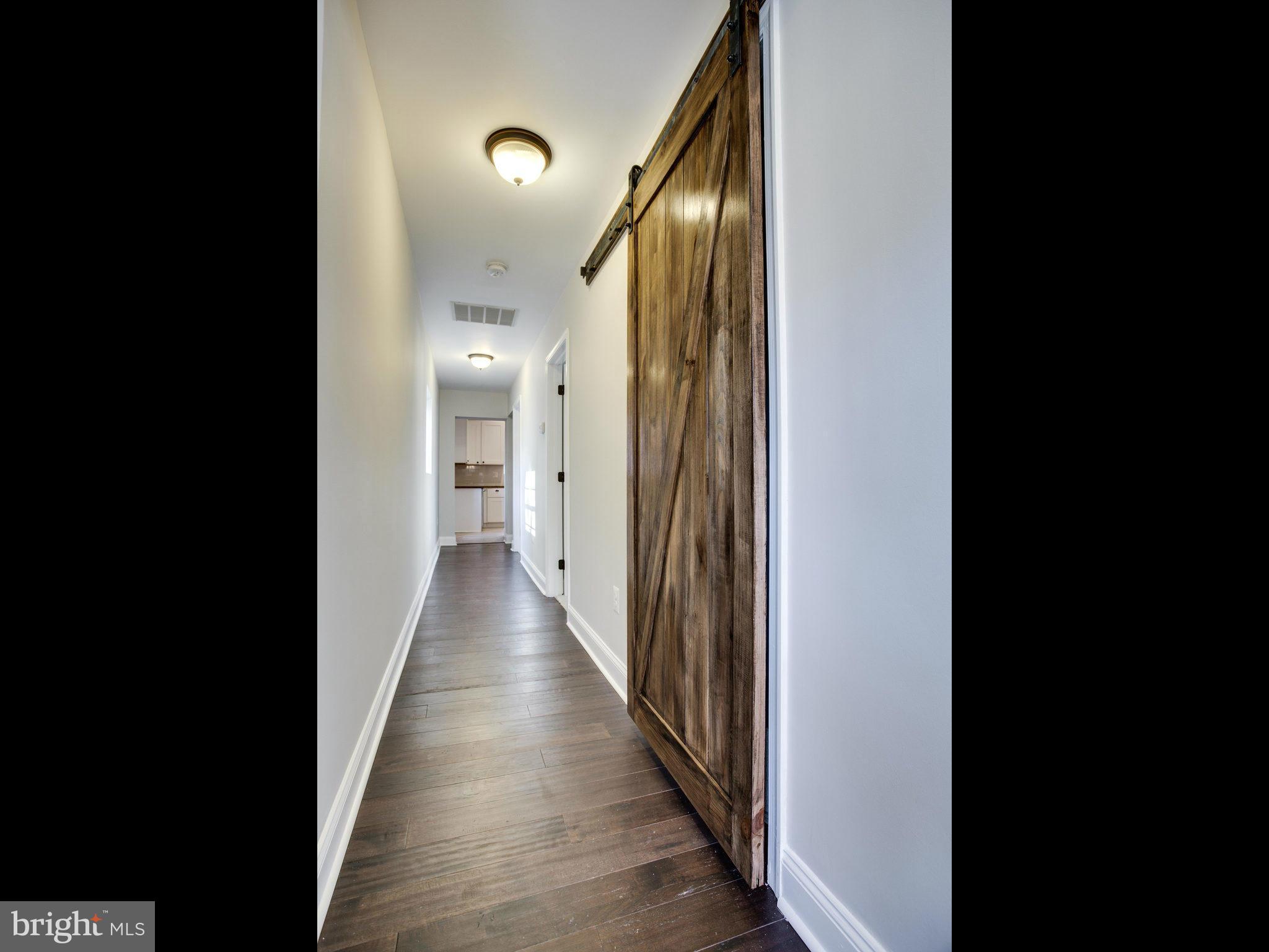 1704 Forestville Road Edgewater, MD 21037 - Photo 10 of 24 a view of a hallway with wooden floor