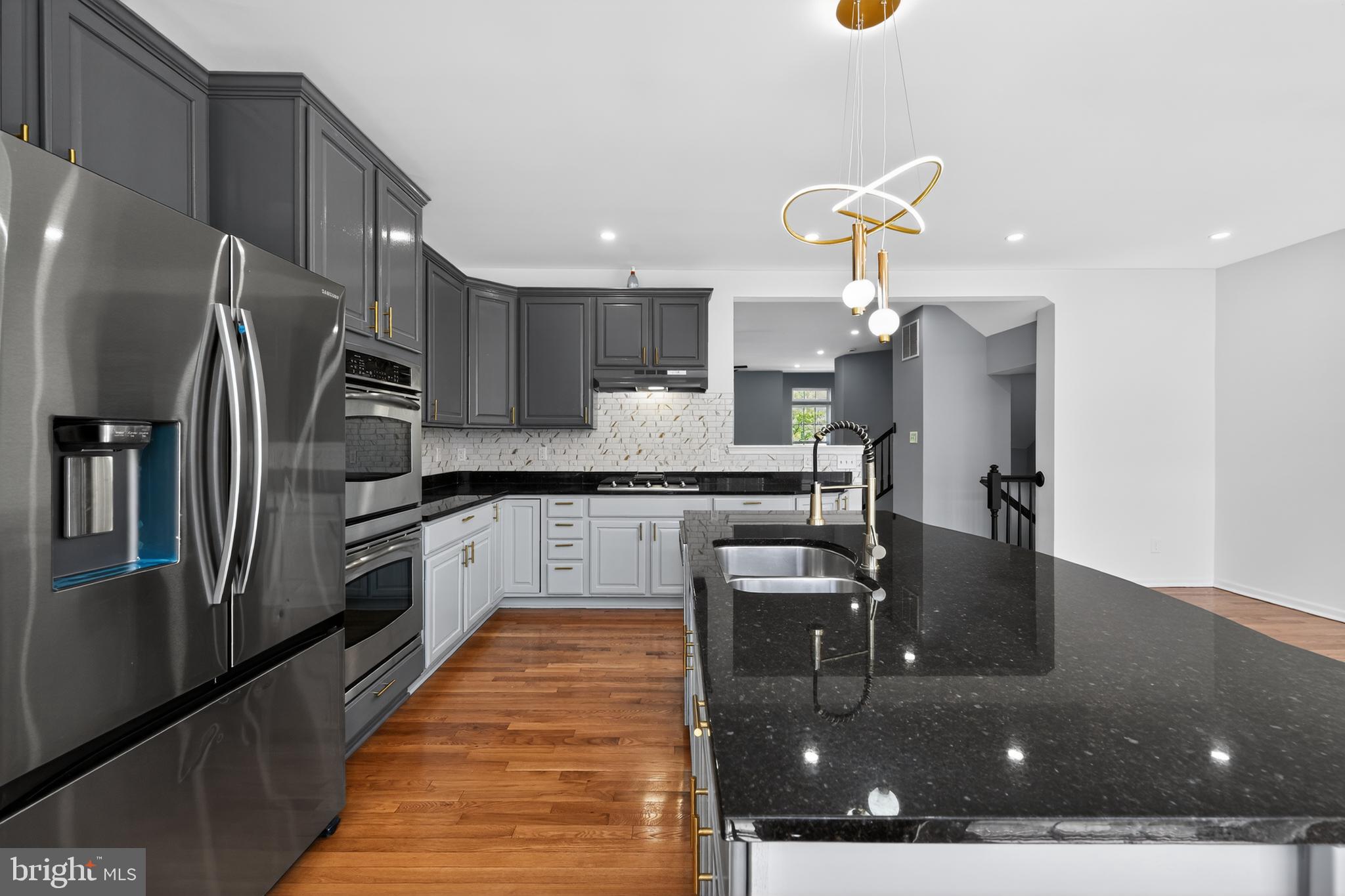 3 Swan Court Delran, NJ 08075 - Photo 15 of 34 a kitchen with stainless steel appliances granite countertop a refrigerator and a stove