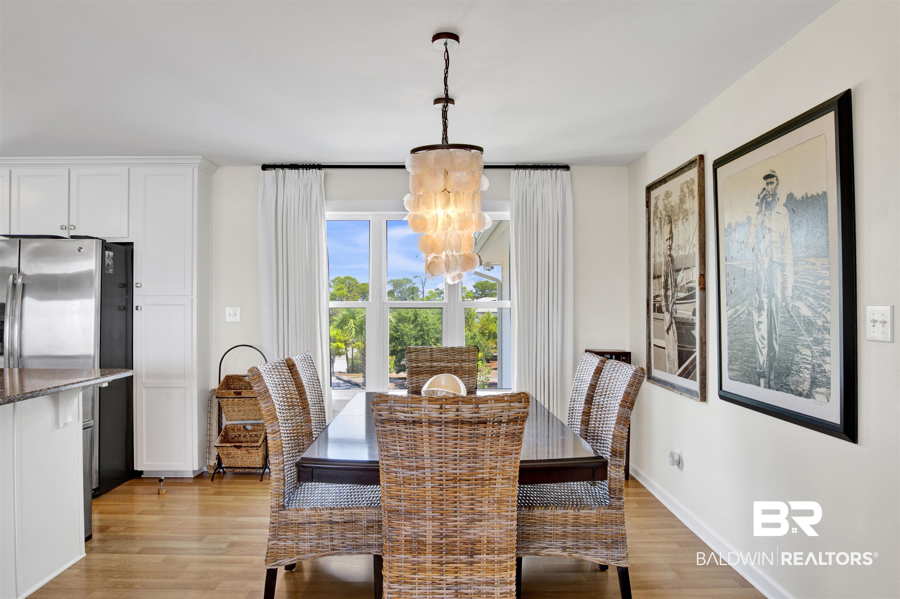 30538 River Road Orange Beach, AL 36561 - Photo 18 of 78 Dining space with a chandelier and light wood finished floors