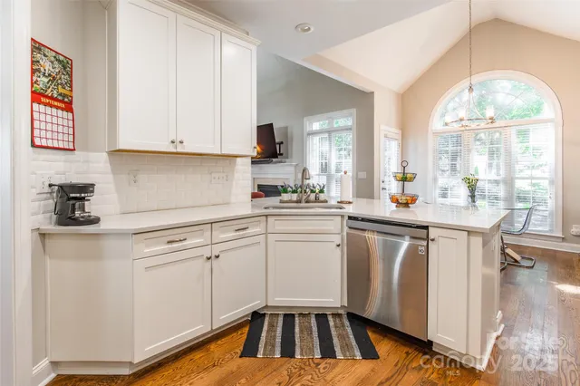 a kitchen with a white cabinets and white appliances