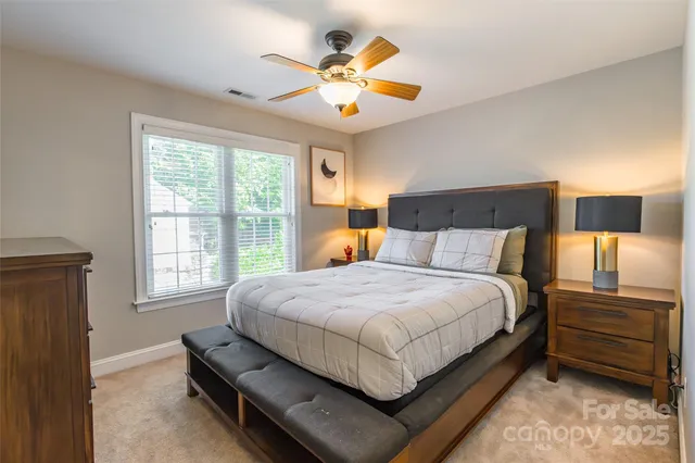 a bedroom with bed and window
