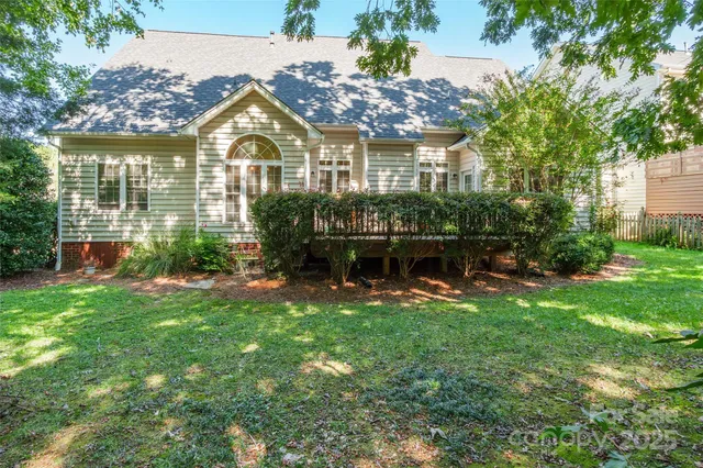 a front view of a house with a yard table and chairs