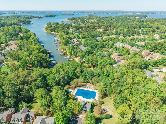 an aerial view of a houses with a yard