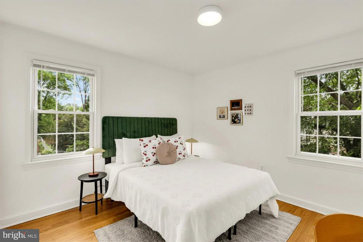 2030 Luzerne Avenue Silver Spring, MD 20910 - Photo 20 of 25 a bedroom with a bed and a window