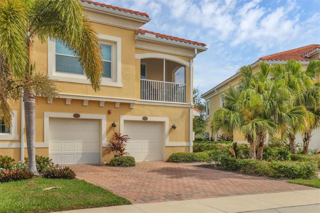 4236 Expedition Way, Unit 106 Osprey, FL 34229 - Photo 1 of 1 front view of a house with a yard